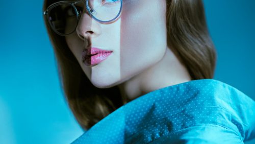 Glasses fashion. Portrait of a beautiful young woman in elegant glasses. Business style.