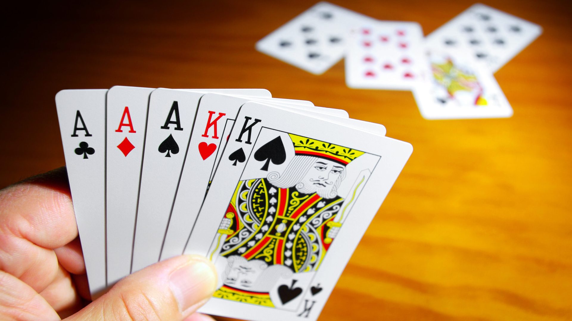 A good set of playing cards in the had of the gambler