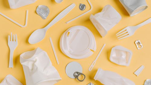 Food  plastic packaging  on  yellow background. Concept of Recycling plastic and ecology. Flat lay, top view